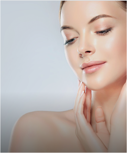 Woman with glowing, hydrated skin touching her jaw after IV therapy