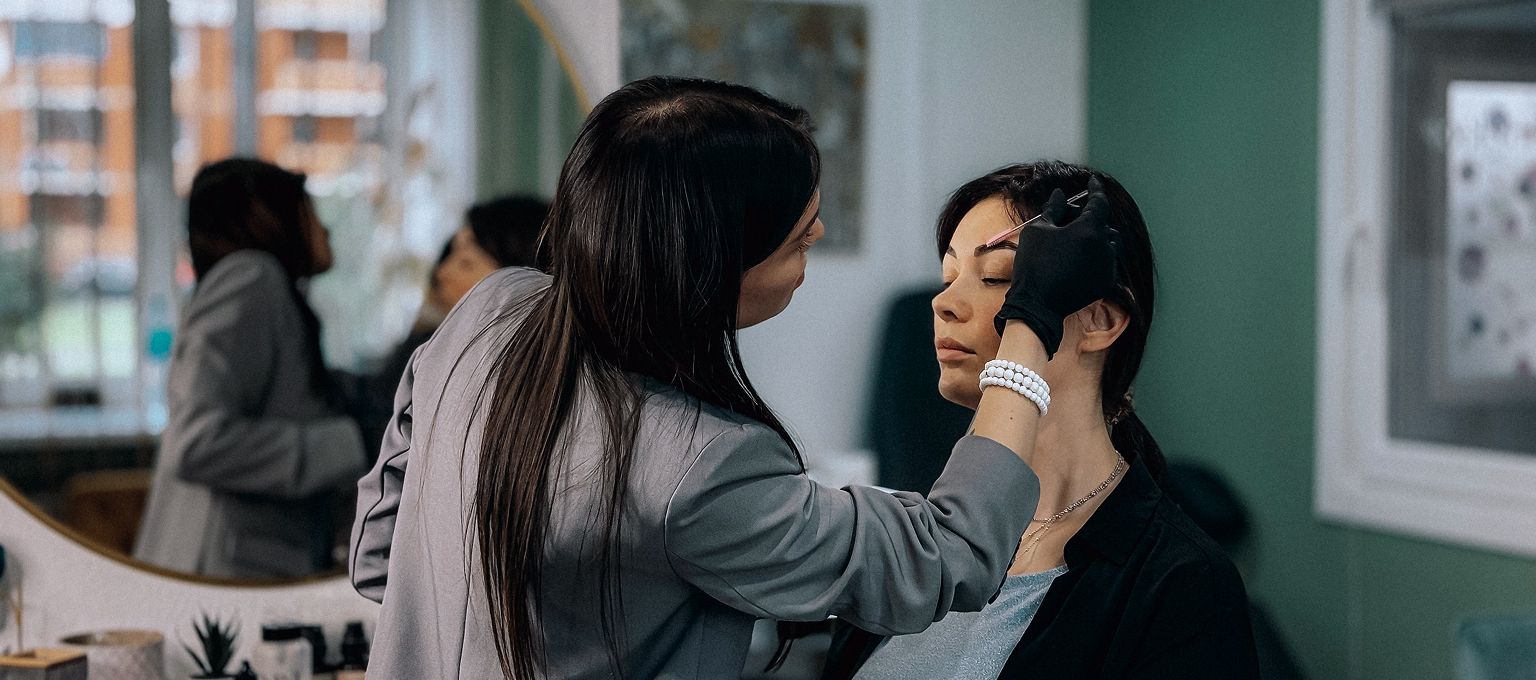 Aesthetic provider consulting with a client in a modern studio