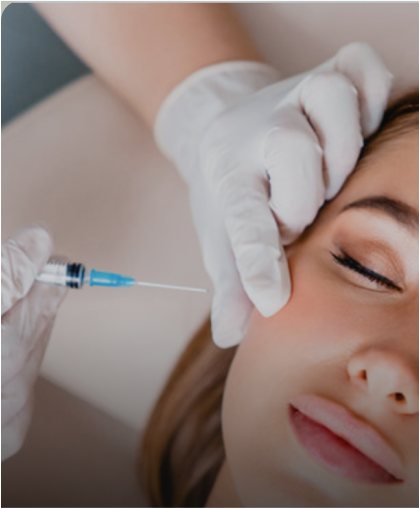 Provider in gloves injecting Botox near the eye area of a client