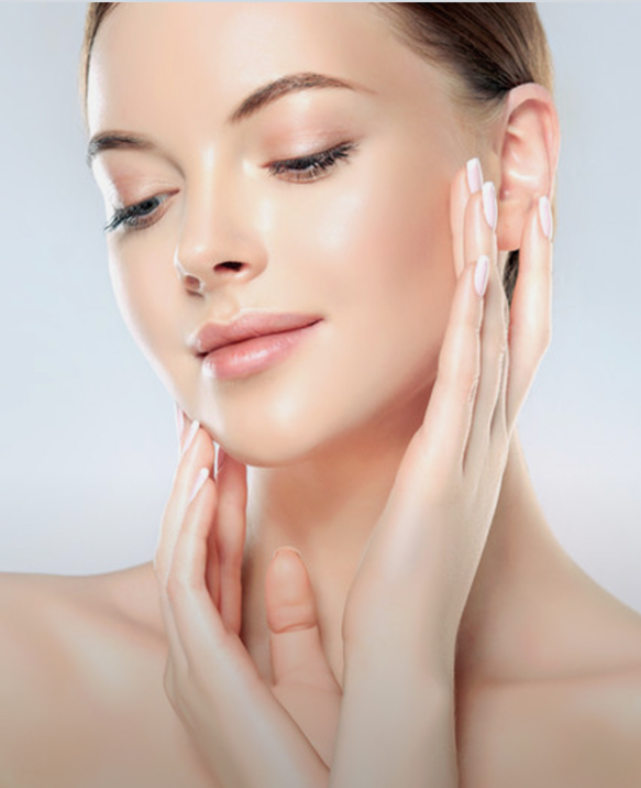 Woman with smooth, natural-looking skin touching her face